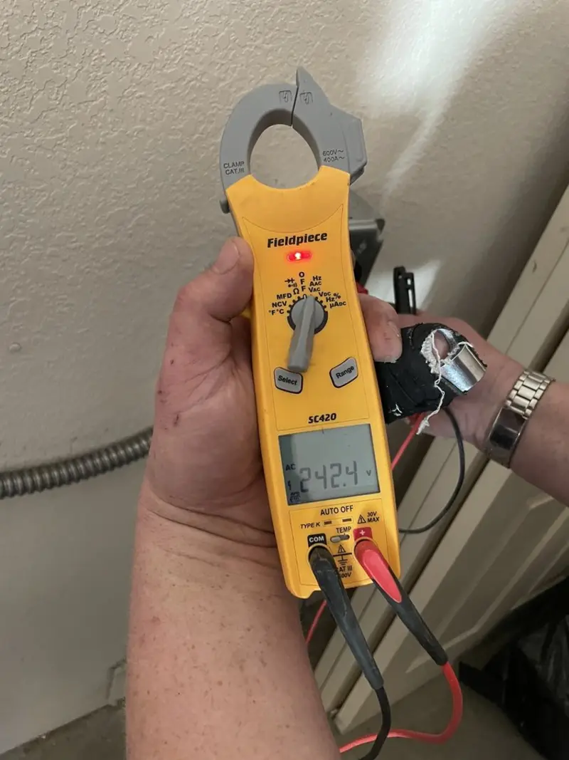 Voltage testing with clamp meter during Aluminum Wiring Replacement in Garland